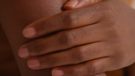 Close-Up-Studio-Skincare-Beauty-Shot-Of-Young-Woman-Feeling-Softness-Of-Skin-On-Arm-2